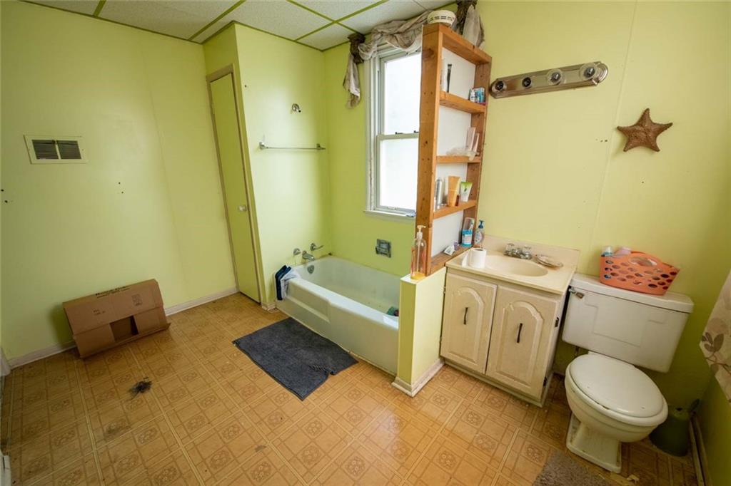 823 Lippencott Road Waynesburg, PA 15370 - Photo 21 of 25 a spacious bathroom with a granite countertop sink a toilet and a bathtub