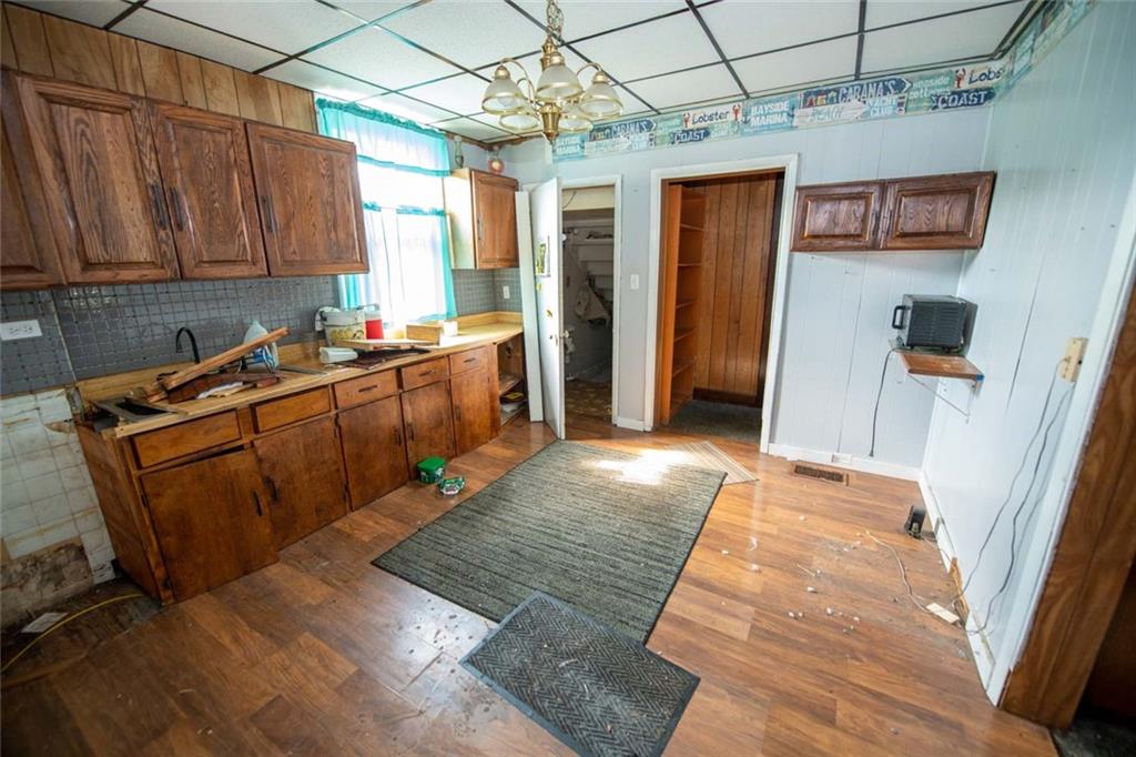 823 Lippencott Road Waynesburg, PA 15370 - Photo 4 of 25 a kitchen with stainless steel appliances granite countertop wooden cabinets a sink and dishwasher