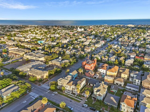 an aerial view of residential houses with outdoor space