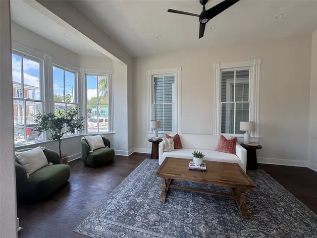 a living room with furniture and a rug