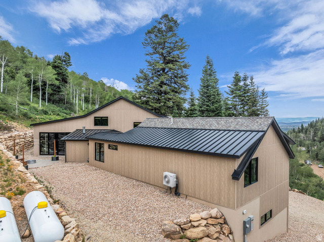 1766 West Tollgate Cyn Road Coalville, UT 84017 - Photo 51 of 59 Contemporary architecture featuring light-toned vertical siding and a dark metal roof