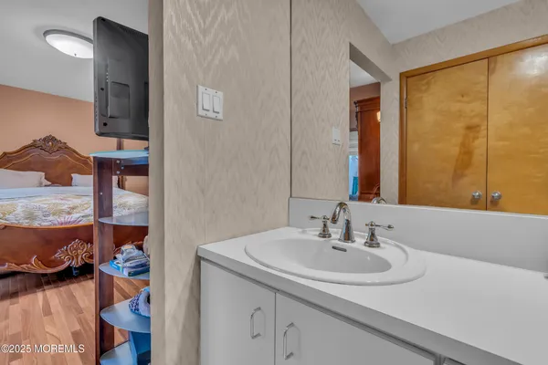 a bathroom with a sink and a mirror