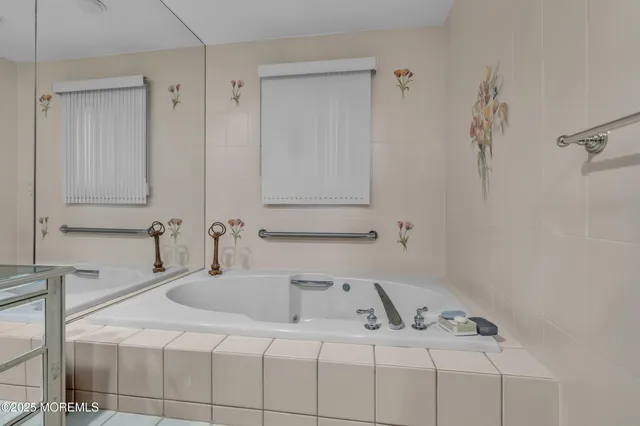 a bathroom with a sink and vanity