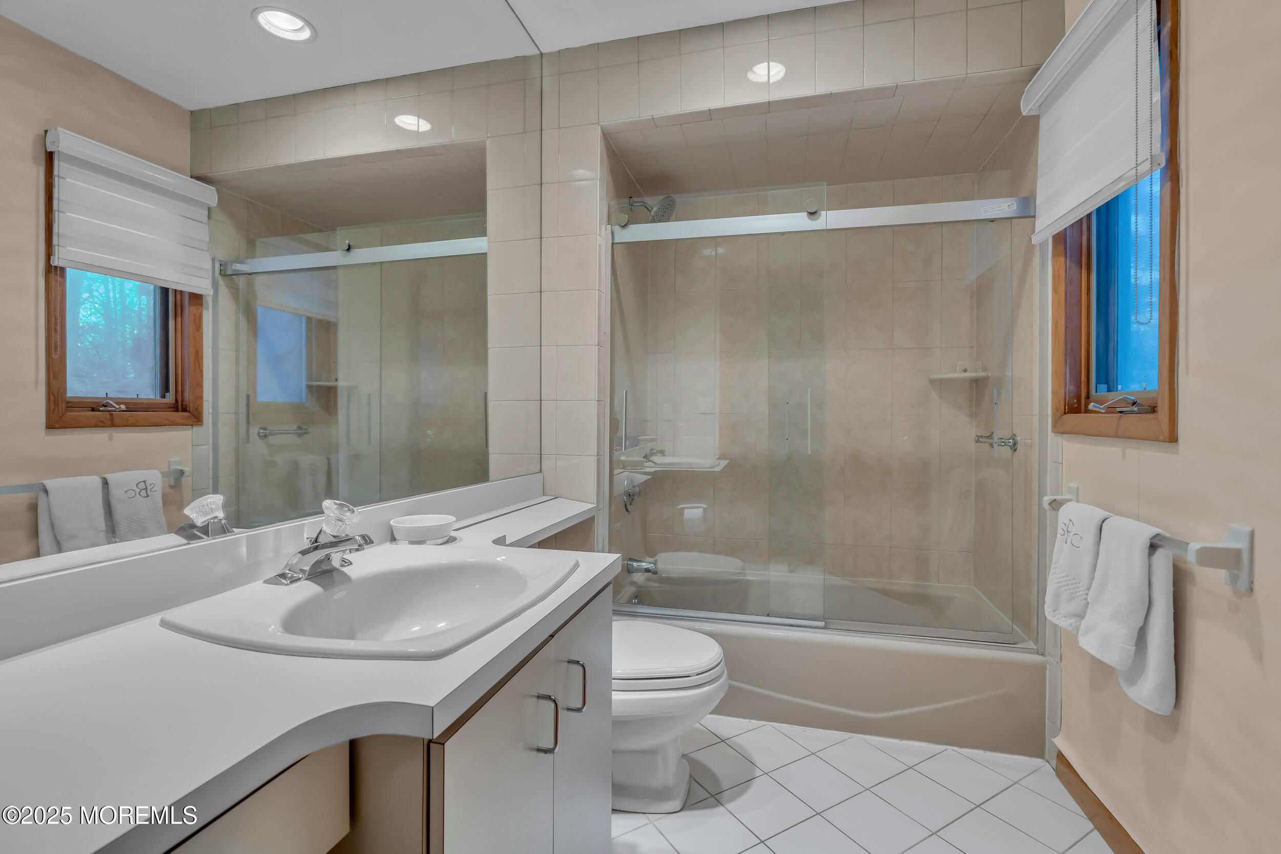 8 Ross Court Oakhurst, NJ 07755 - Photo 22 of 37 a bathroom with a sink a toilet and shower