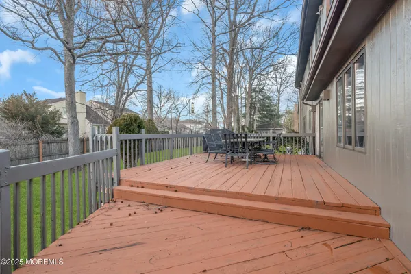 a view of backyard with sitting area