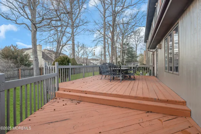 a view of backyard with sitting area