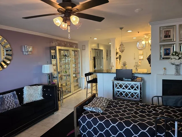 a bedroom with a bed and glass walk in closet