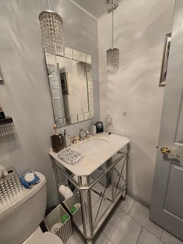 a bathroom with a sink a vanity and a mirror