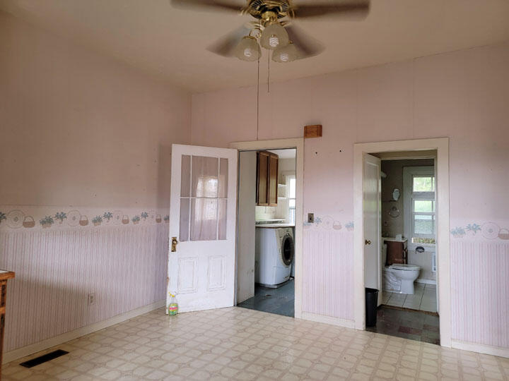 120 13th Street Arcata, CA 95521 - Photo 9 of 37 a bedroom with a bed and a chandelier
