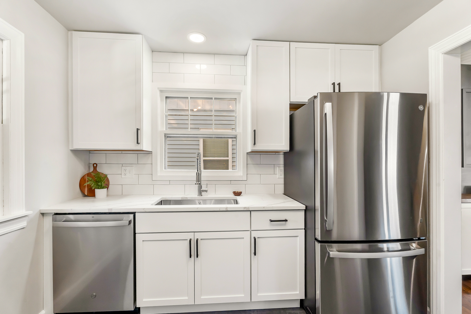 18540 Miller Drive Lansing, IL 60438 - Photo 16 of 57 a kitchen with stainless steel appliances a refrigerator sink and cabinets