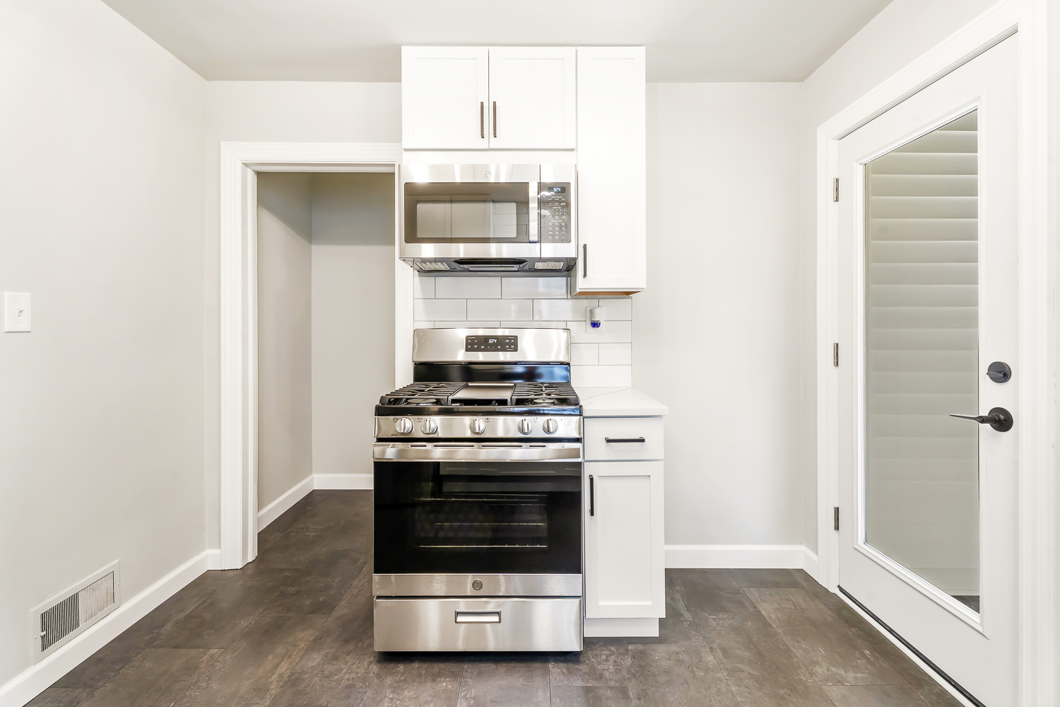 18540 Miller Drive Lansing, IL 60438 - Photo 18 of 57 a kitchen with a stove and a microwave