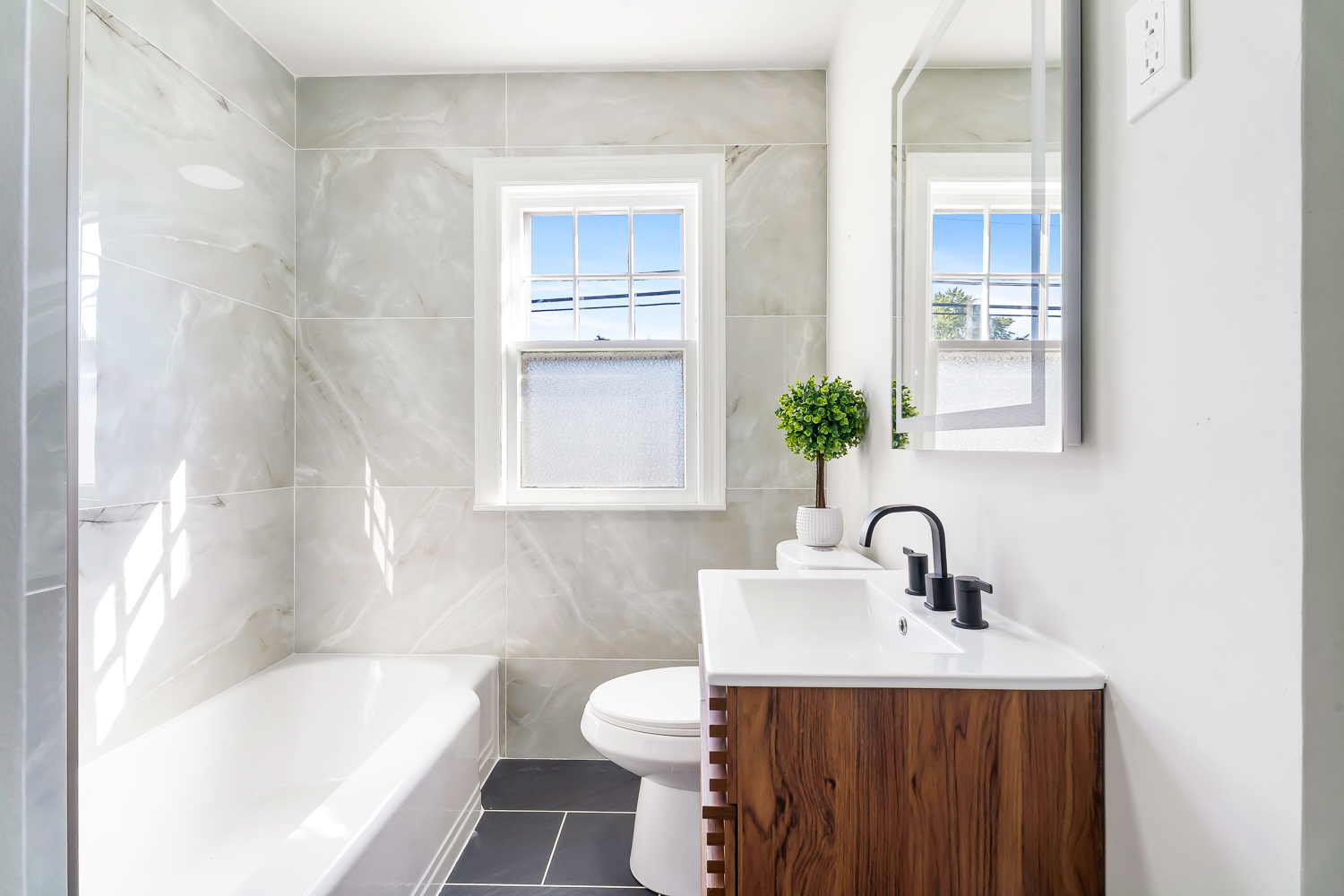 18540 Miller Drive Lansing, IL 60438 - Photo 21 of 57 a bathroom with a sink toilet and shower