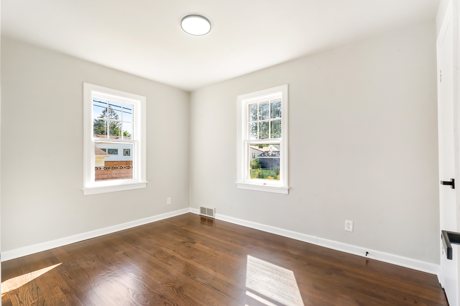18540 Miller Drive Lansing, IL 60438 - Photo 25 of 57 an empty room with wooden floor and windows