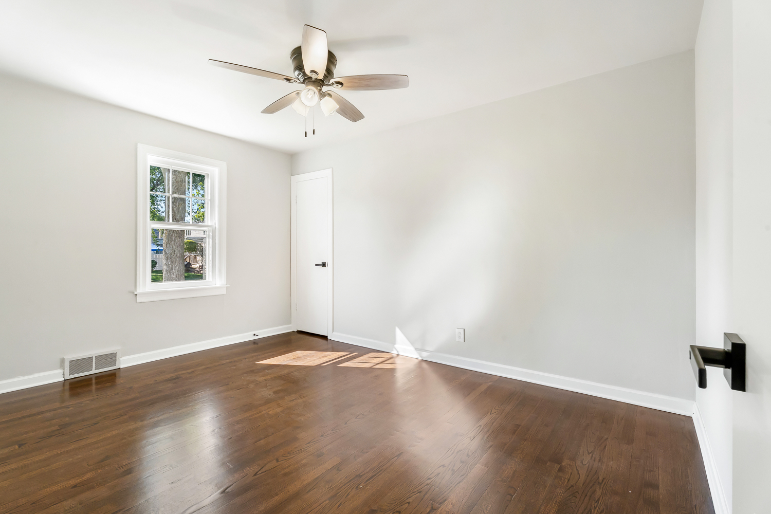 18540 Miller Drive Lansing, IL 60438 - Photo 27 of 57 a view of a big room with wooden floor and windows