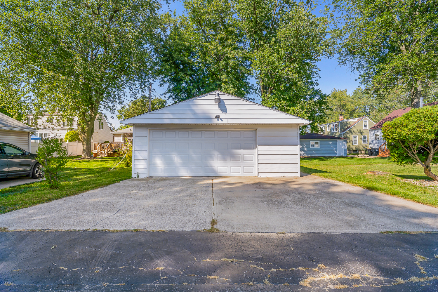 18540 Miller Drive Lansing, IL 60438 - Photo 41 of 57 a front view of a house with a yard and garage