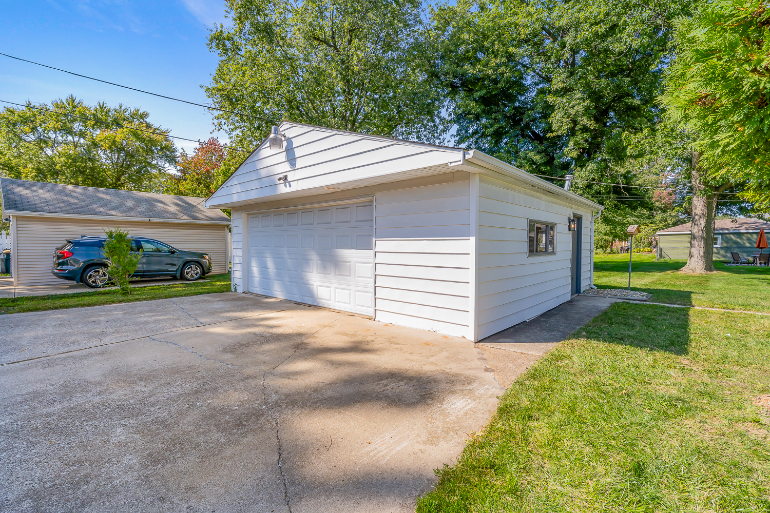 18540 Miller Drive Lansing, IL 60438 - Photo 42 of 57 a front view of a house with a yard and garage