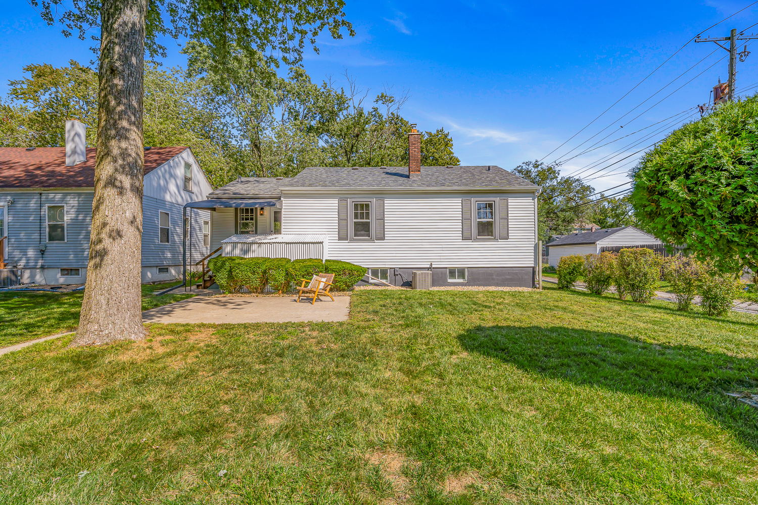 18540 Miller Drive Lansing, IL 60438 - Photo 46 of 57 a view of a house with a big yard and potted plants