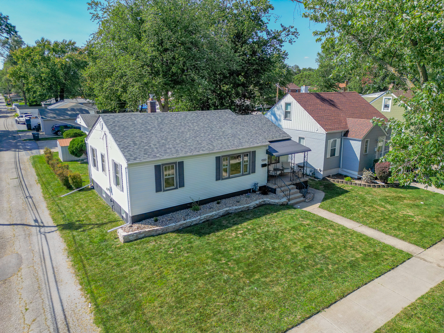 18540 Miller Drive Lansing, IL 60438 - Photo 50 of 57 a aerial view of a house with a yard table and chairs