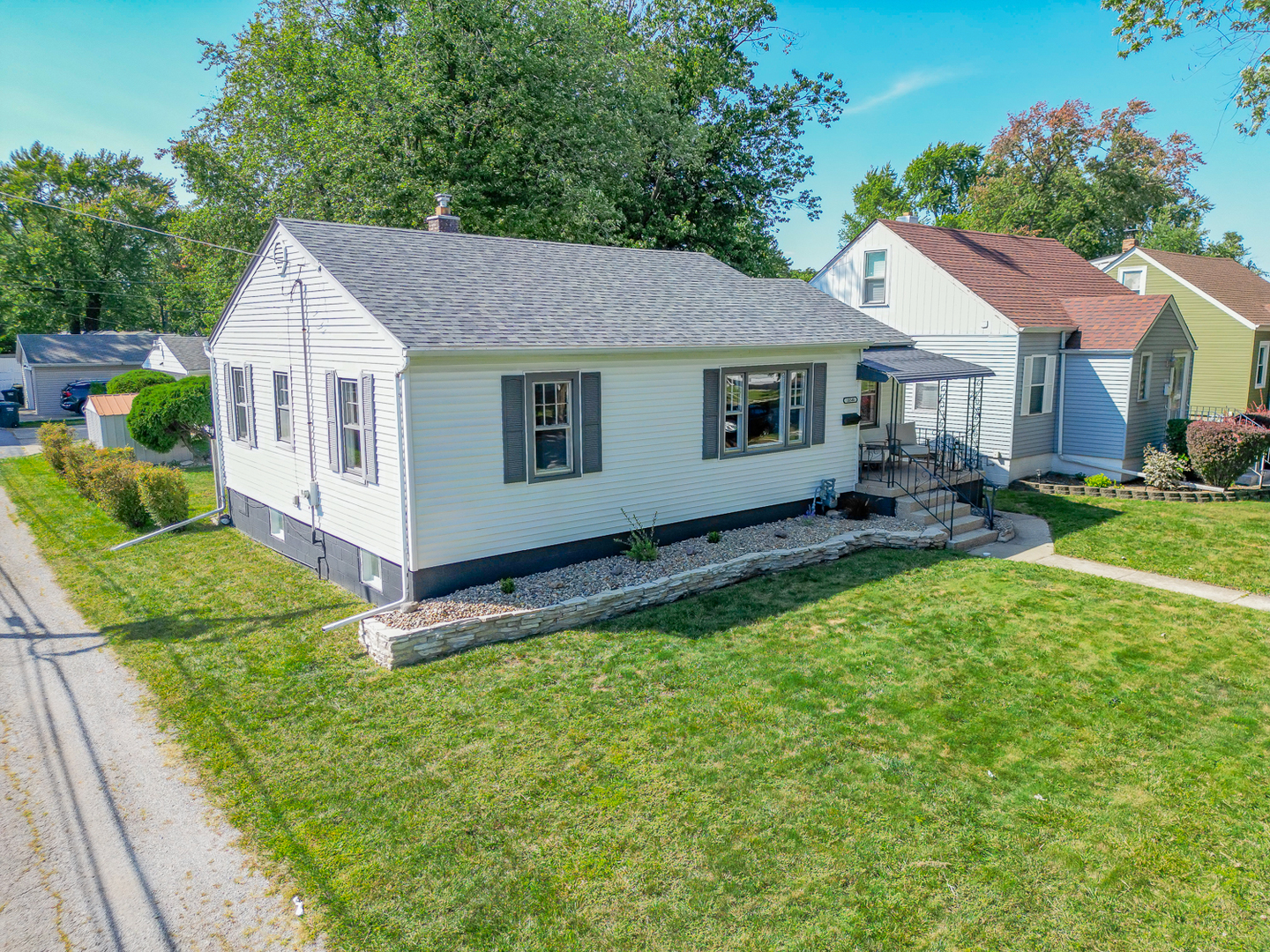 18540 Miller Drive Lansing, IL 60438 - Photo 51 of 57 a front view of a house with garden