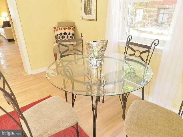 11611 Gail Street Silver Spring, MD 20902 - Photo 20 of 30 a view of a dining room with furniture and wooden floor
