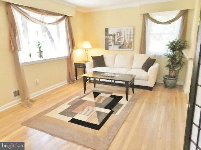 11611 Gail Street Silver Spring, MD 20902 - Photo 3 of 30 a living room with furniture rug and a window