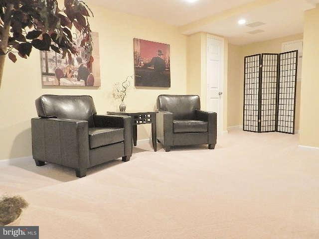 11611 Gail Street Silver Spring, MD 20902 - Photo 22 of 30 a living room with furniture and a flat screen tv
