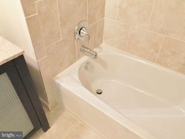 11611 Gail Street Silver Spring, MD 20902 - Photo 24 of 30 a bathroom with a tub