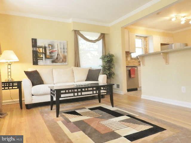 11611 Gail Street Silver Spring, MD 20902 - Photo 4 of 30 a living room with furniture and a rug