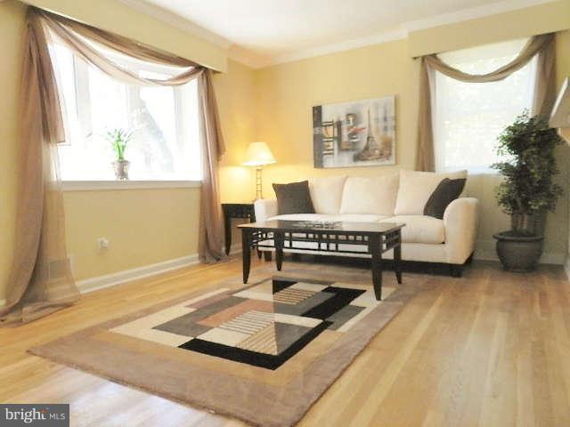 11611 Gail Street Silver Spring, MD 20902 - Photo 5 of 30 a living room with a couch and a table