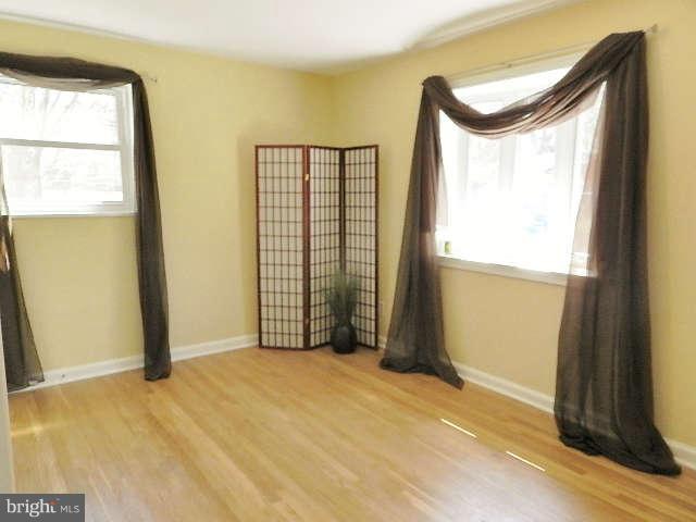 11611 Gail Street Silver Spring, MD 20902 - Photo 6 of 30 a view of an empty room with a window