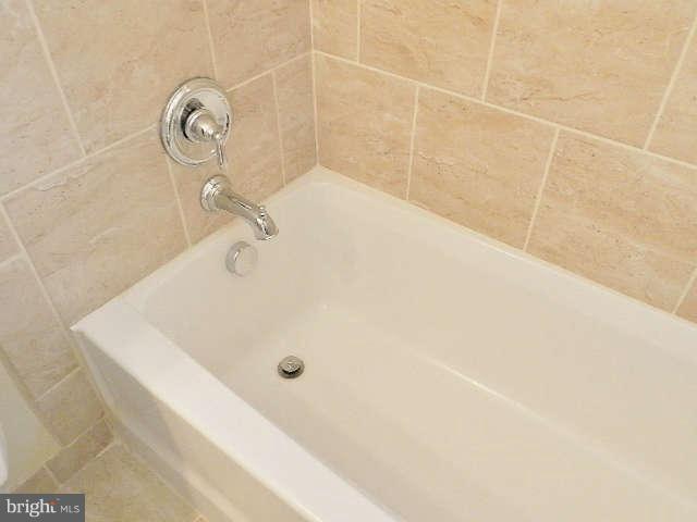 11611 Gail Street Silver Spring, MD 20902 - Photo 10 of 30 a bathroom with a tub