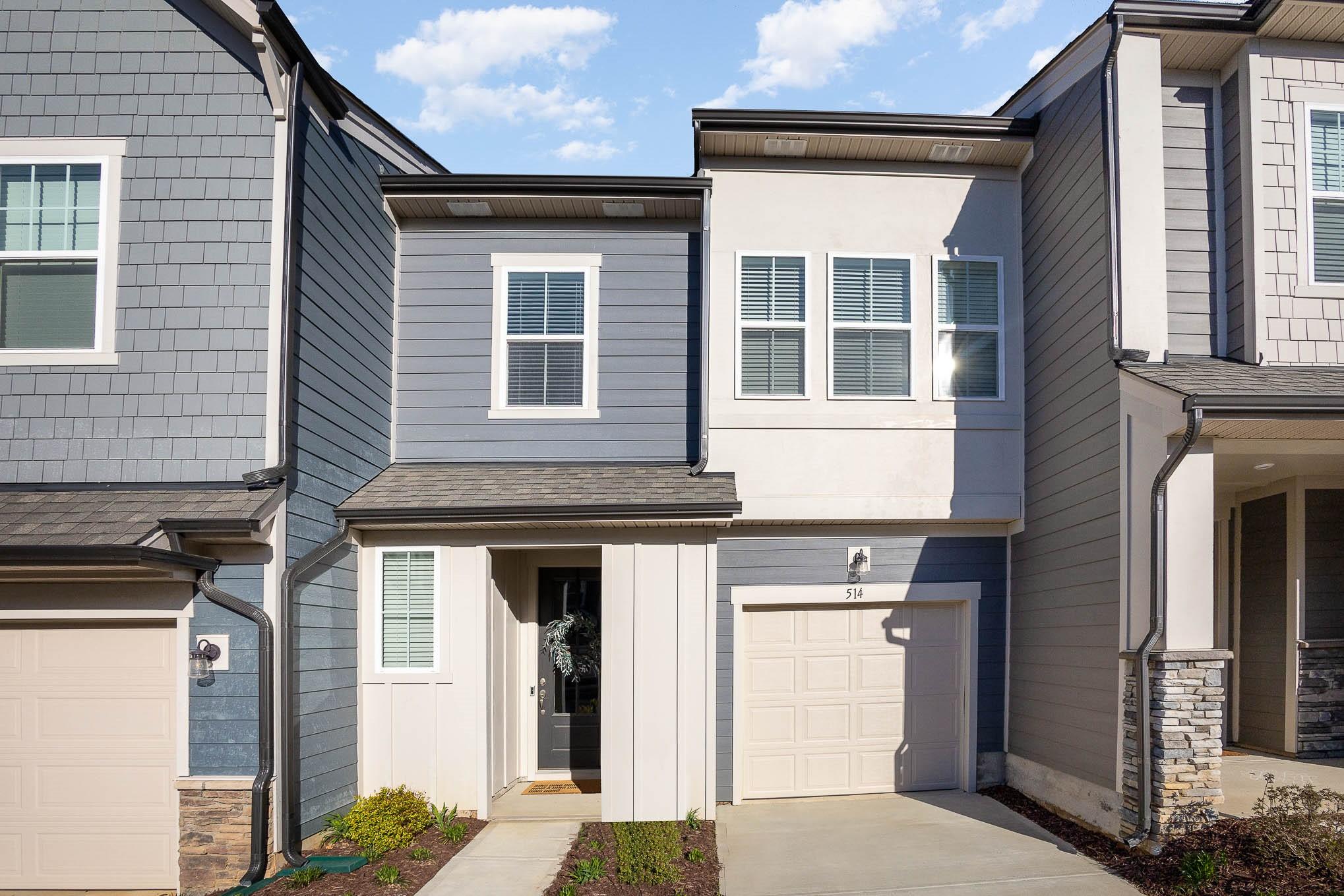 a front view of a house with a garage
