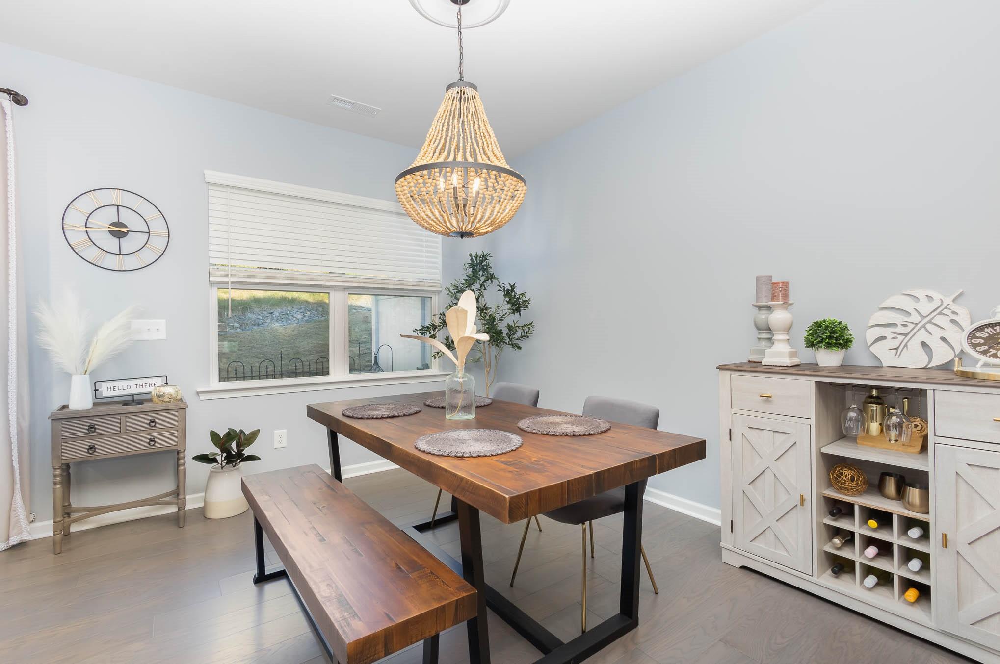 514 Madison Falls Fort Mill, SC 29708 - Photo 11 of 29 a view of a dining room with furniture window and wooden floor