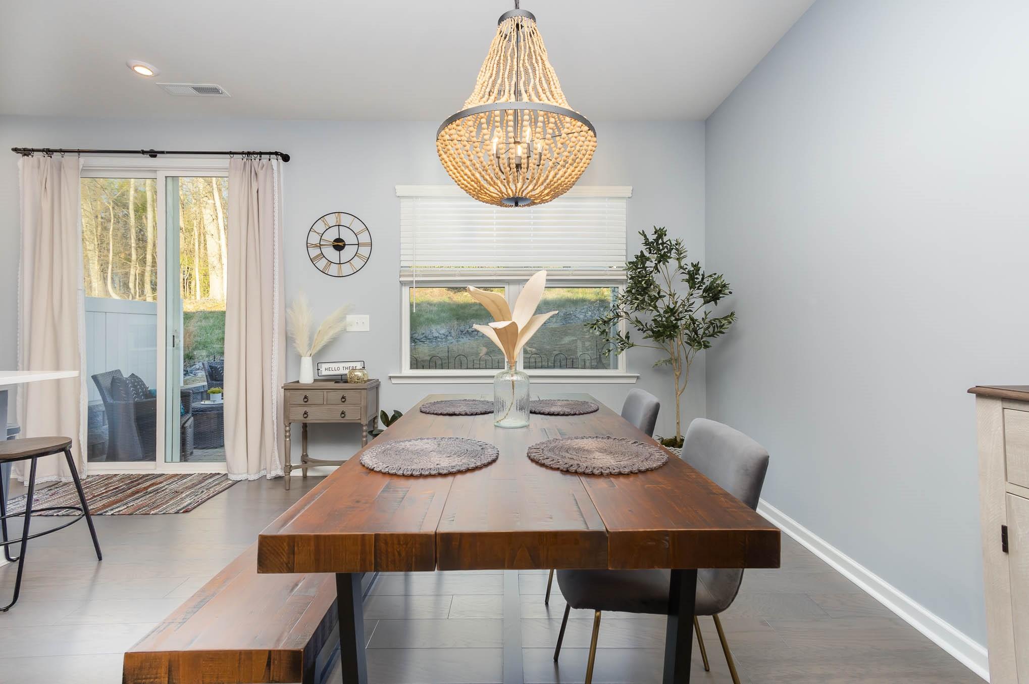 514 Madison Falls Fort Mill, SC 29708 - Photo 12 of 29 a view of a dining room with furniture and chandelier