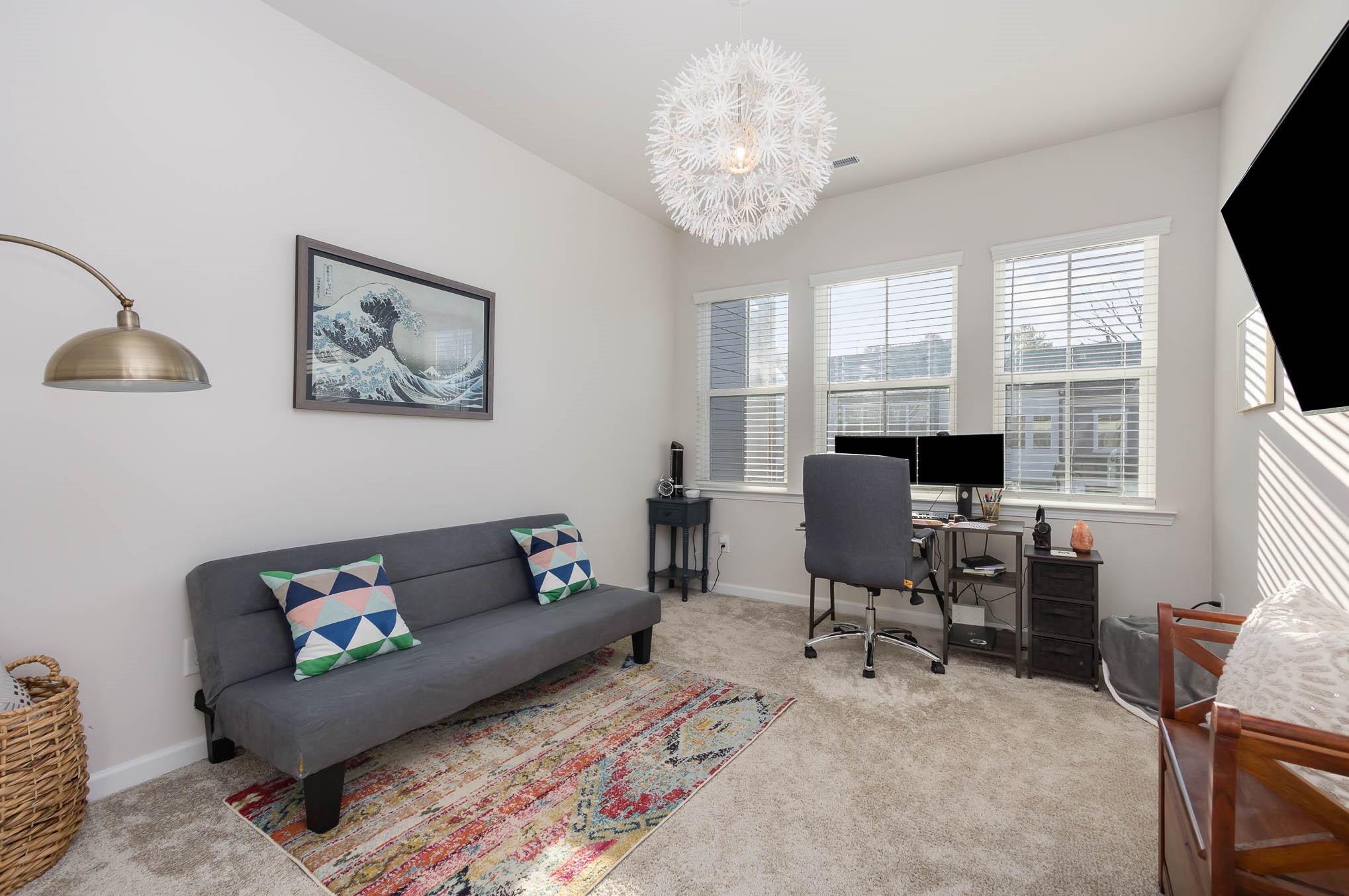 514 Madison Falls Fort Mill, SC 29708 - Photo 15 of 29 a living room with furniture two window and a flat screen tv