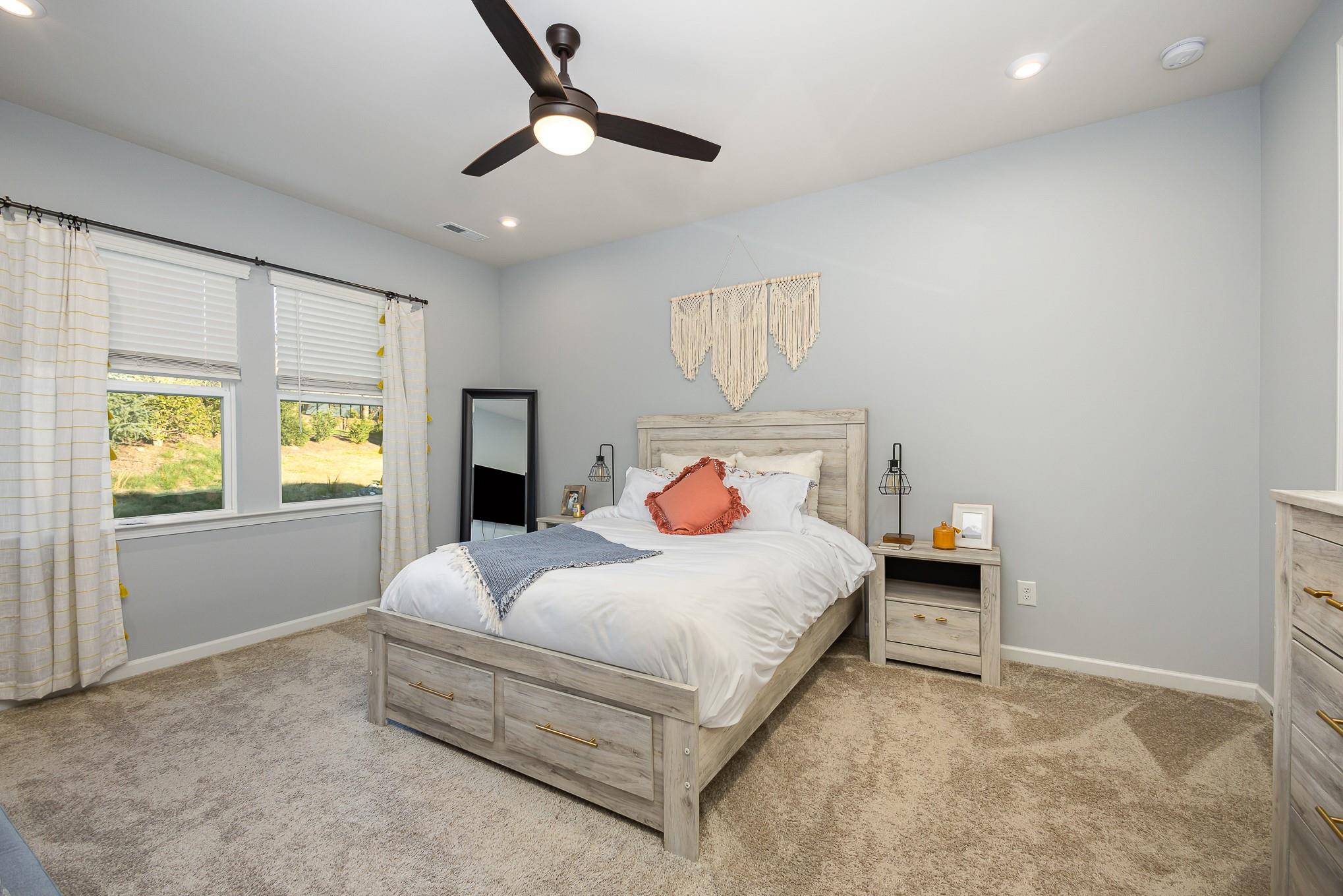 514 Madison Falls Fort Mill, SC 29708 - Photo 17 of 29 a bedroom with a bed and a window