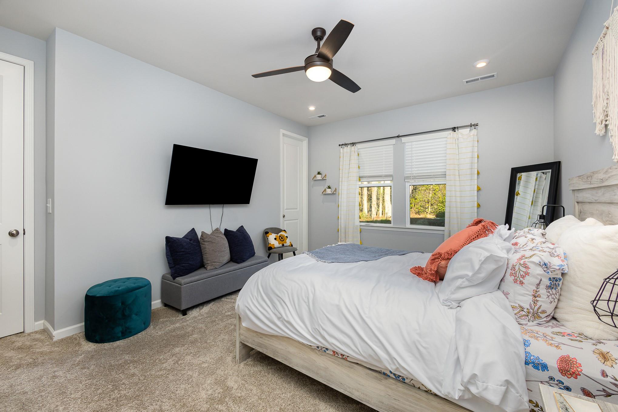 514 Madison Falls Fort Mill, SC 29708 - Photo 18 of 29 a bedroom with bed tv and window