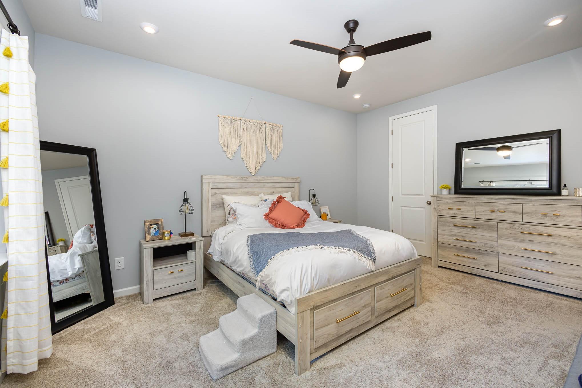 514 Madison Falls Fort Mill, SC 29708 - Photo 19 of 29 a bedroom with a bed and a flat screen tv