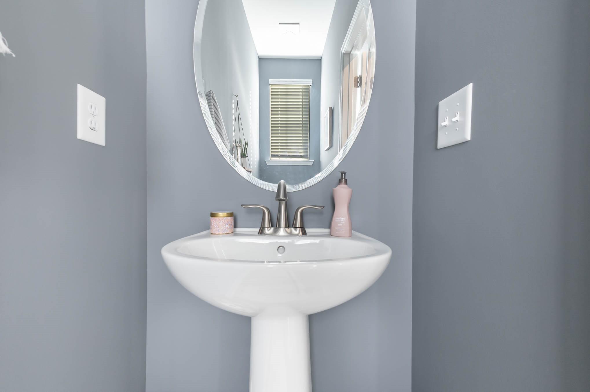 514 Madison Falls Fort Mill, SC 29708 - Photo 21 of 29 a bathroom with a sink and a mirror