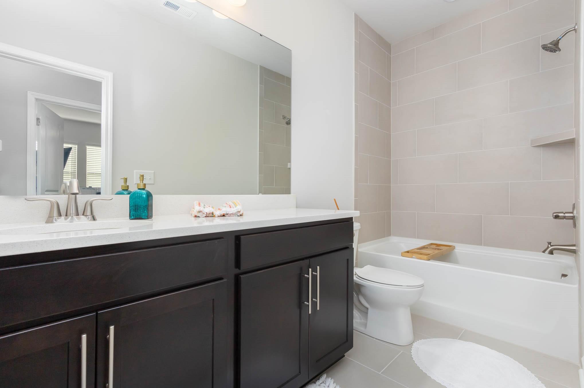 514 Madison Falls Fort Mill, SC 29708 - Photo 24 of 29 a bathroom with a sink toilet tub and shower