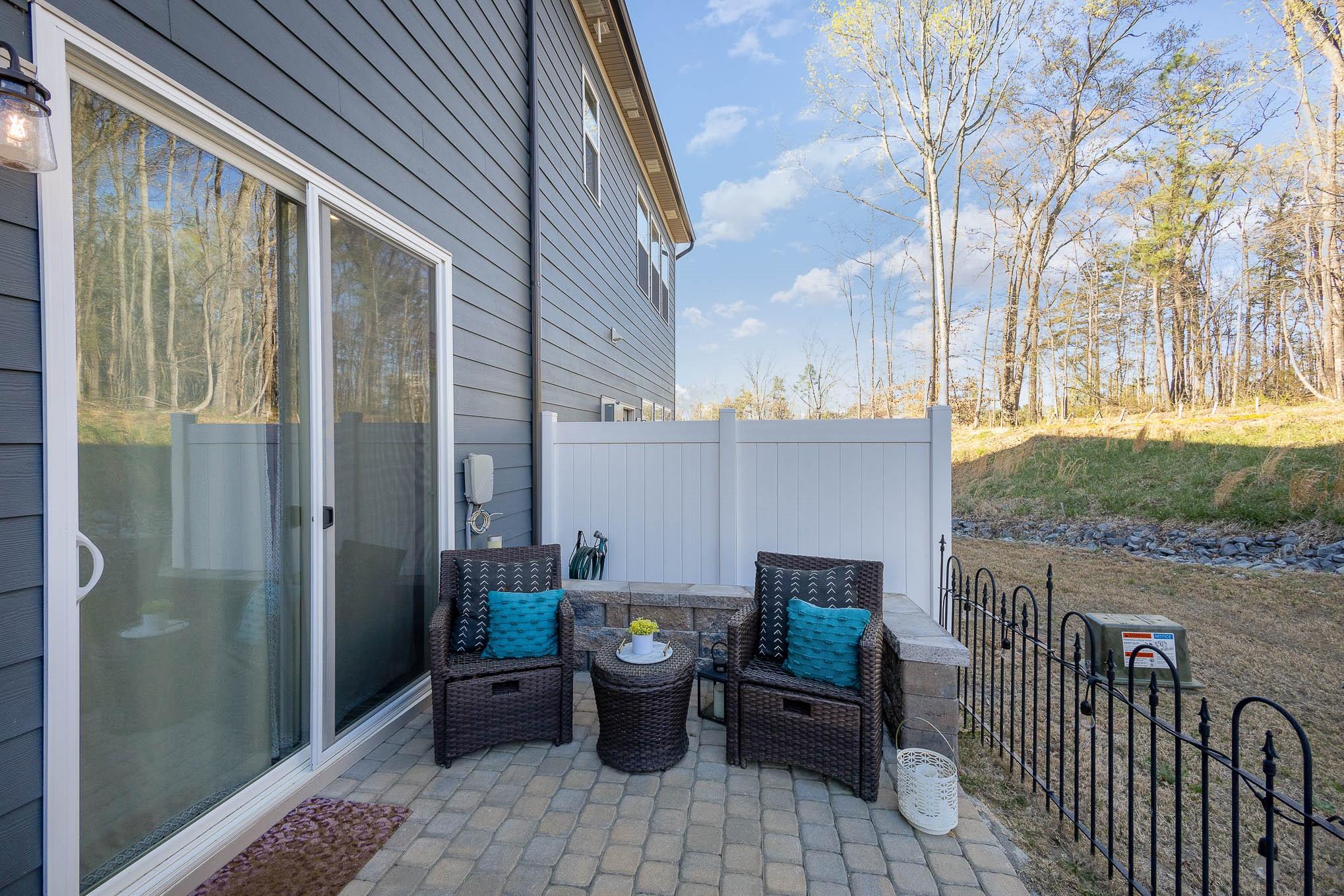 514 Madison Falls Fort Mill, SC 29708 - Photo 28 of 29 a view of a balcony with chair and wooden fence