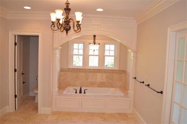 27 Whipple Road Lexington, MA 02420 - Photo 18 of 24 a bathroom with a bathtub and a chandelier