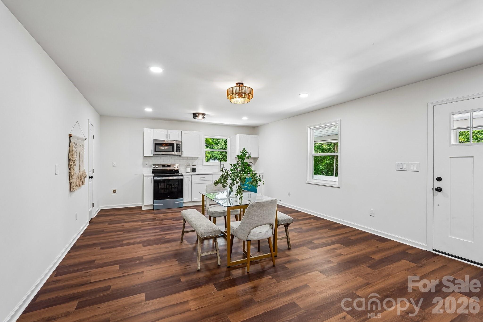514 West Arch Street Lancaster, SC 29720 - Photo 11 of 43 a living room with furniture wooden floor and a fireplace