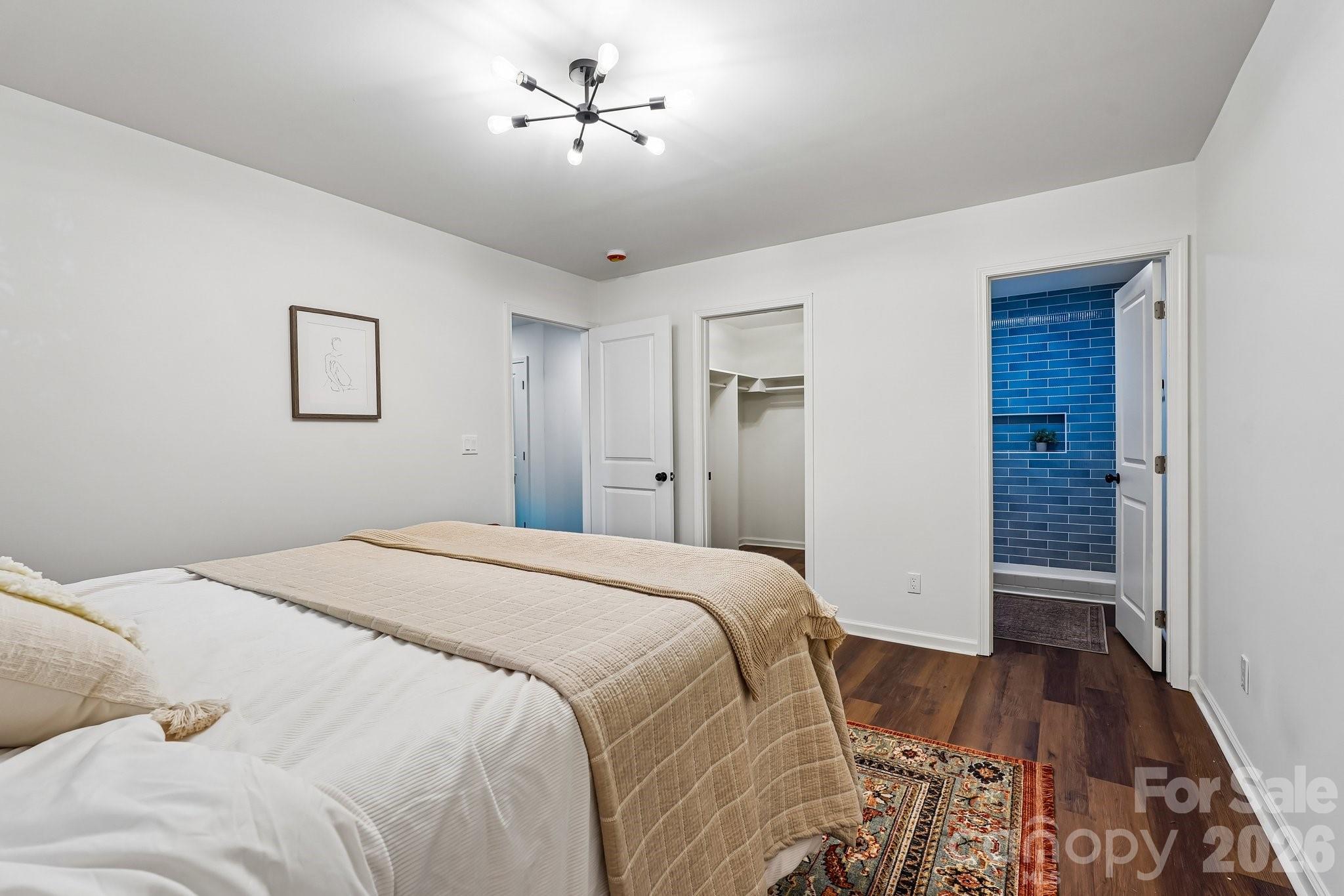 514 West Arch Street Lancaster, SC 29720 - Photo 16 of 43 a spacious bedroom with a bed and a walk in closet