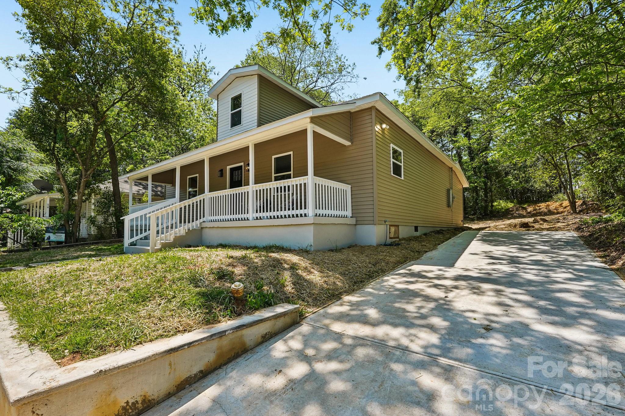 514 West Arch Street Lancaster, SC 29720 - Photo 2 of 43 a house with trees in the background