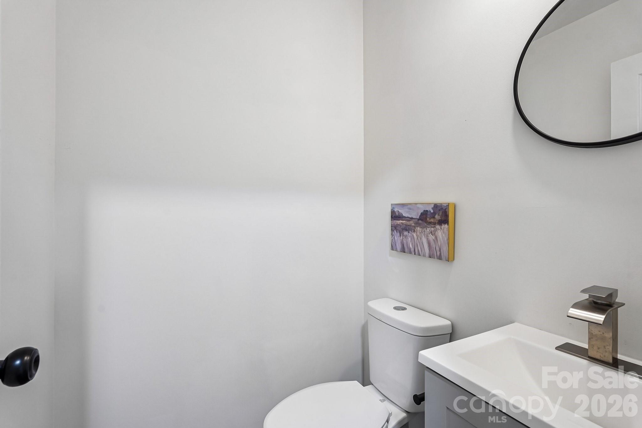 514 West Arch Street Lancaster, SC 29720 - Photo 22 of 43 a bathroom with a toilet and a sink