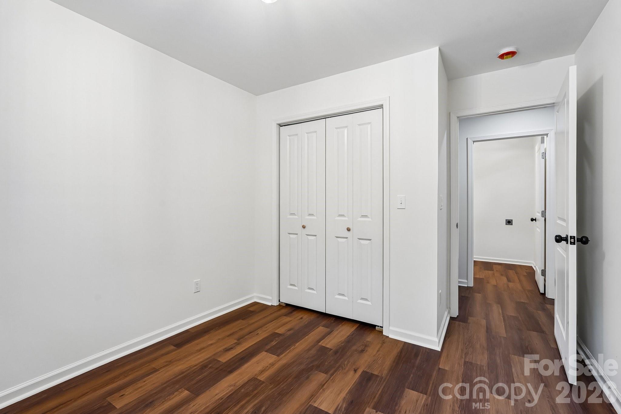 514 West Arch Street Lancaster, SC 29720 - Photo 30 of 43 a view of an empty room with wooden floor and closet