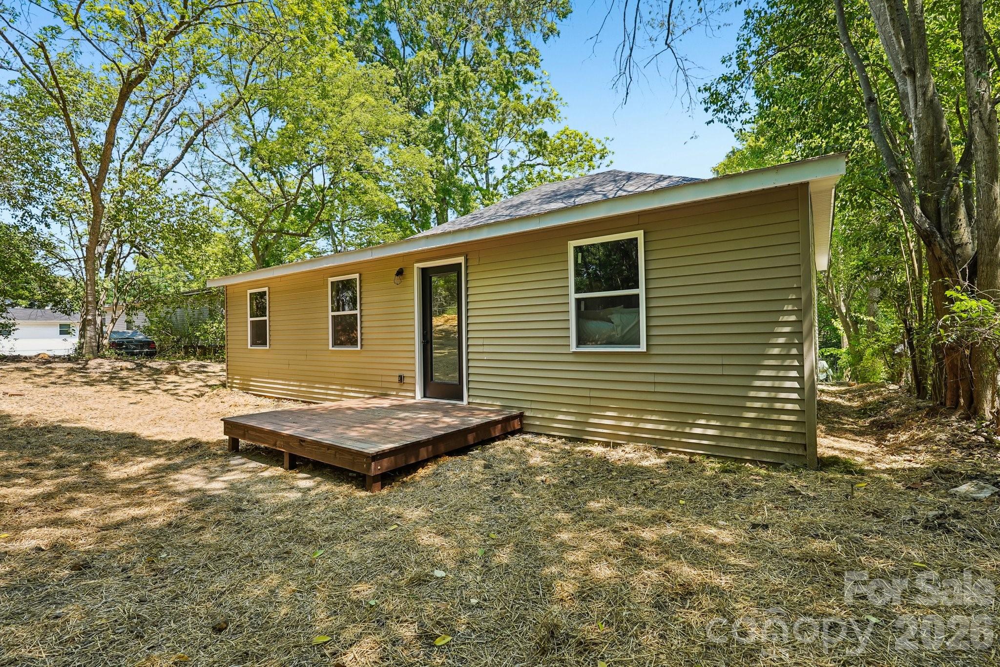 514 West Arch Street Lancaster, SC 29720 - Photo 39 of 43 a view of a house with a backyard
