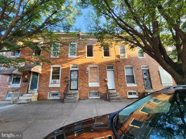 a view of a building with a large tree
