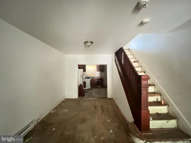 a view of a hallway with staircase